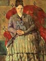 madame cezanne in a red armchair